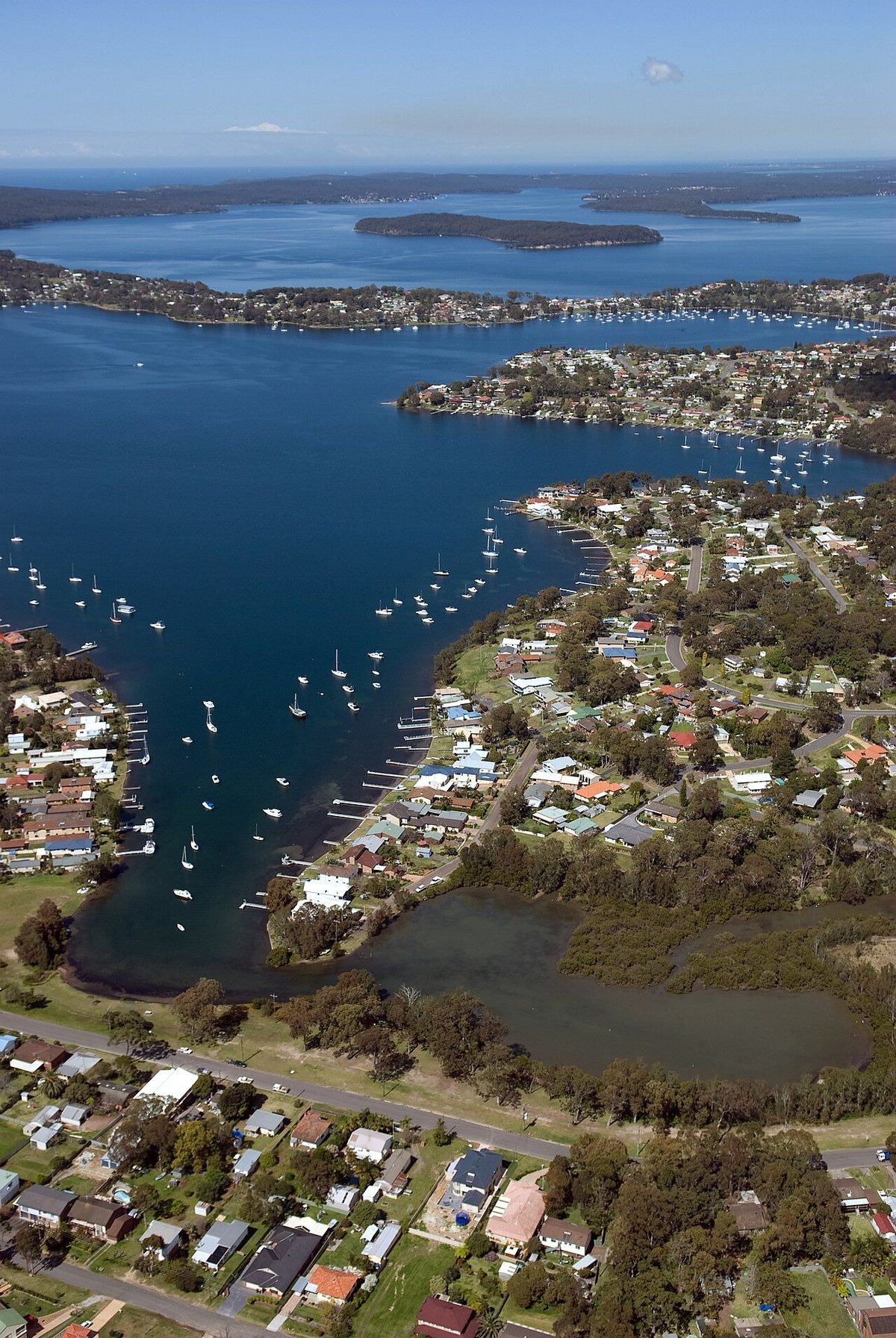Aerial view of moored boats and headlands on Lake Macquarie, New South Wales