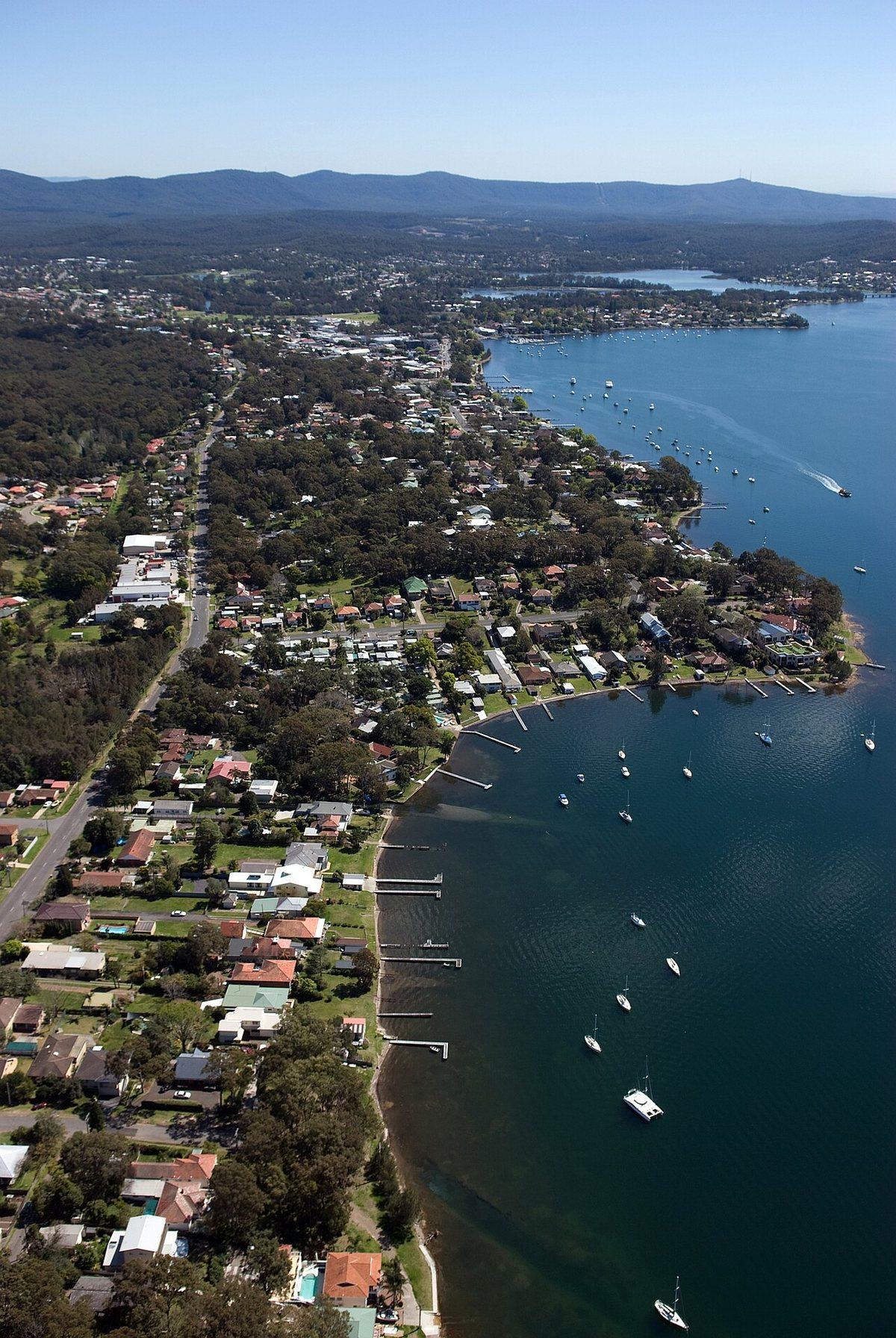 Aerial view of the Lake Macquarie shoreline and moored yachts, New South Wales