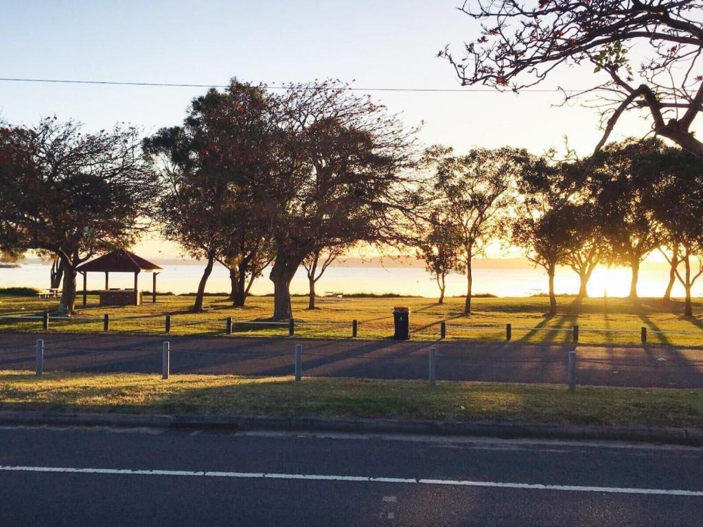 Lake Macquarie at golden hour, seen from the Pacific Highway opposite Lakeview Motor Inn, Belmont South NSW